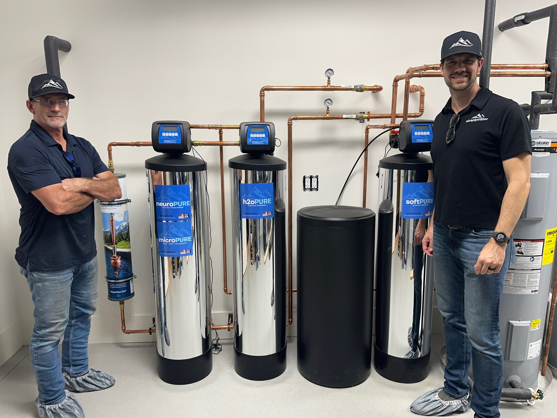 Simply Water technicians with a completed multi-system residential installation